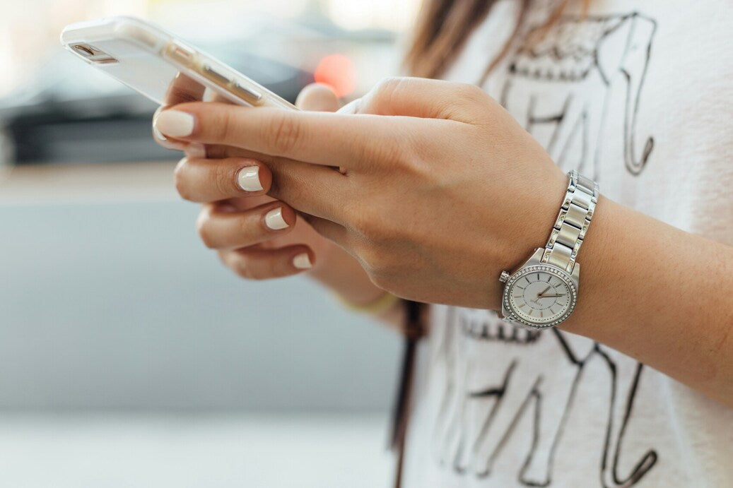 Person holding a mobile phone